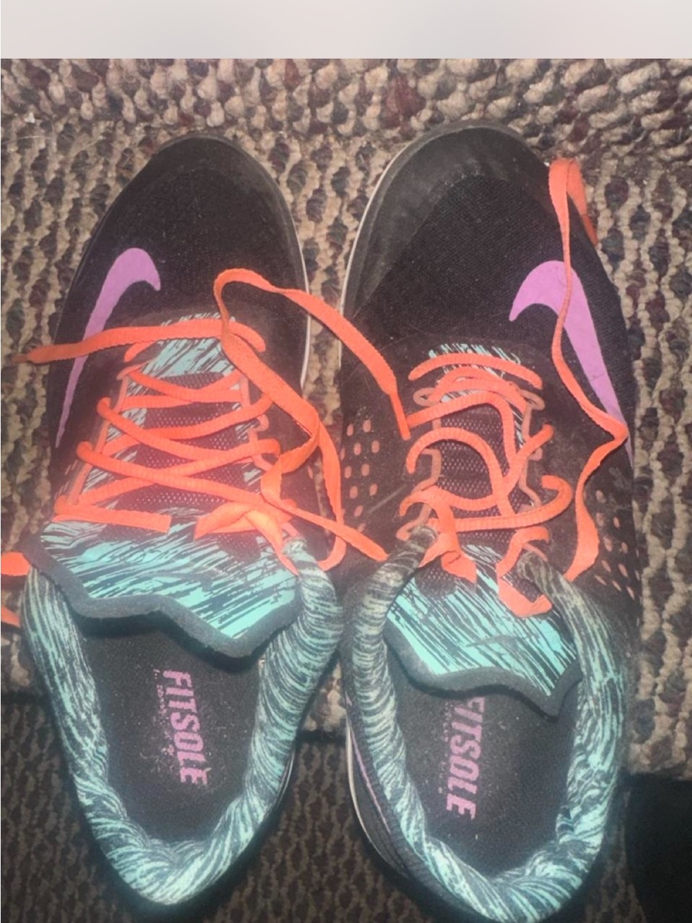 Black Athletic Nike Sneakers with Purple Swoosh and Orange Laces